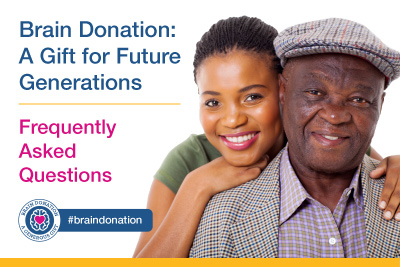 Female African American woman hugging older African American male from behind.
